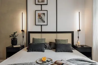 a living room with a couch and a tv at Holzer - 2 bedrooms in Sant Antoni in Barcelona