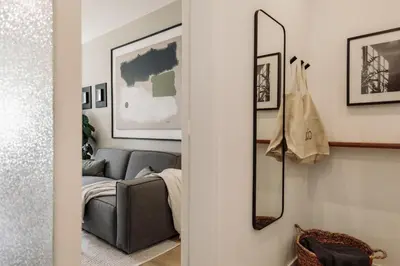 a bedroom with a bed with a tray of oranges on it at Holzer - 2 bedrooms in Sant Antoni in Barcelona