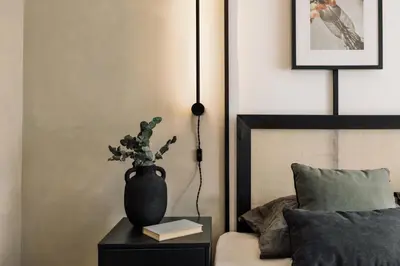 a bedroom with a bed with a plate of food on it at Holzer - 2 bedrooms in Sant Antoni in Barcelona