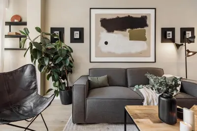 a living room with a glass table and a bed at Holzer - 2 bedrooms in Sant Antoni in Barcelona