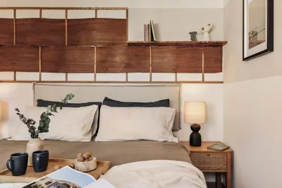 a bedroom with a large bed with a book at Isora - 1 bedroom in El Gòtic in Barcelona