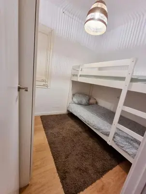 a bedroom with a bunk bed with a ladder at Confort y Calma en Barcelona in Barcelona