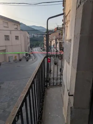 a view of a street from a balcony of a building at Ca l'Emília, hasta 6 pers, Monistrol de Montserrat in Monistrol