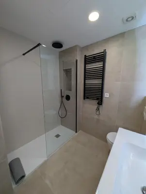 a bathroom with a shower and a toilet and a sink at Ca l'Emília, hasta 6 pers, Monistrol de Montserrat in Monistrol