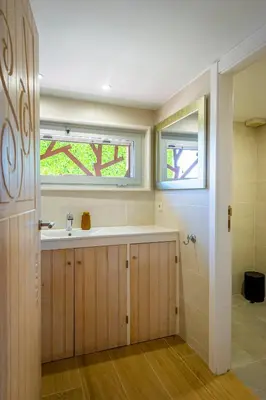 a bathroom with a sink and a window at Cal Magí in San Martín Sarroca