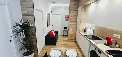 a small kitchen with a sink and a stove at 2 apartamentos juntos ideal grupos cerca Barcelona in Badalona