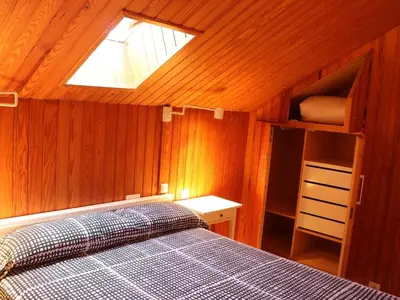 a bedroom with a bed and a skylight at Winahost Loft en casa compartida en Cabrils in Cabrils