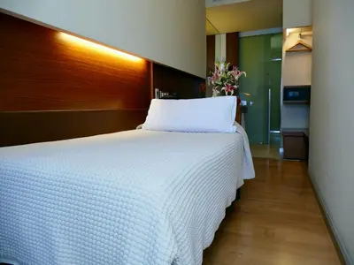 a bedroom with a large white bed in a room at Hotel Turin Barcelona in Barcelona