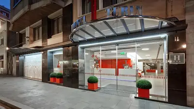 a store front with potted plants in front of it at Hotel Turin Barcelona in Barcelona