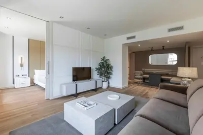 a living room with a couch and a tv at Sweett - Paseo de Gracia - City Centre in Barcelona