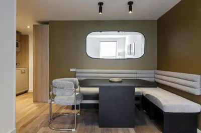 a meeting room with a table and two chairs at Sweett - Paseo de Gracia - City Centre in Barcelona