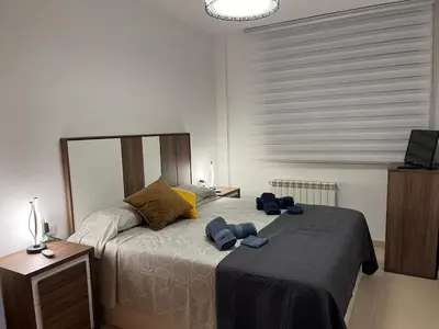 a bedroom with a bed with two towels on it at Holiday near Sitges with private terrace in Vilanova i la Geltrú