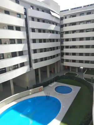 an overhead view of two large buildings with a swimming pool at Contemporary 2BR with Pool & Gym in Hospitalet de Llobregat