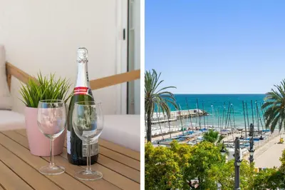 a bottle of wine and two glasses on a table at Sunset Beachfront in Sitges in Sitges