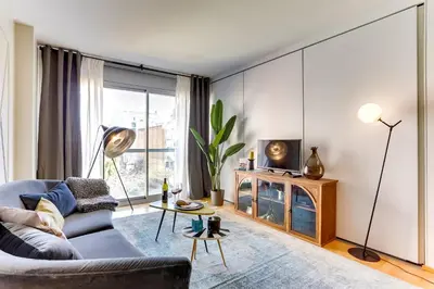 a living room with a couch and a table at Sweett - Calabria in Barcelona