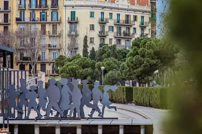 a statue of a group of people walking down a street at Sweett - Calabria in Barcelona