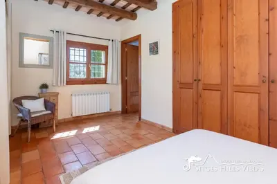 a bedroom in a villa with a large bed at Charming Villa Tamarindo in Olivella