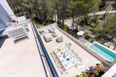 a bathroom with a shower and a toilet and a sink at Villa Valentino Modern Villa with heated pool in Olivella