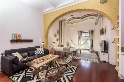 a living room with a couch and a table at Sweett - Loft Villa Olimpica Beach in Barcelona