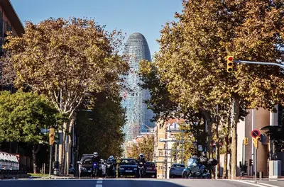 a city street with a traffic light and a tall building at Sweett - Loft Villa Olimpica Beach in Barcelona