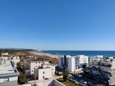 an aerial view of a city and the ocean at Vilanova Beach Stay in Vilanova i la Geltrú
