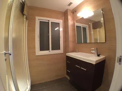a bathroom with a sink and a mirror at Apartamento zona playa de San Sebastian in Sitges