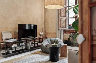 a living room with a couch and a tv at Reus - 1 bedroom in Ciutat Vella in Barcelona