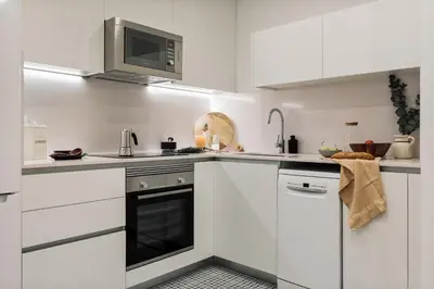 a kitchen with a table with a bowl of fruit on it at Capaccio - 2 bedrooms and terrace in Ciutat Vella in Barcelona