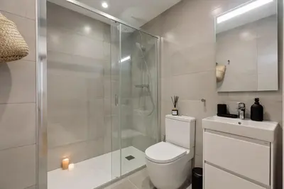 a bedroom with a bed and a mirror at Capaccio - 2 bedrooms and terrace in Ciutat Vella in Barcelona
