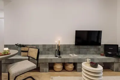 a bathroom with a shower and a toilet and a sink at Capaccio - 2 bedrooms and terrace in Ciutat Vella in Barcelona