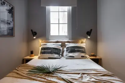 a bathroom with a sink and a vase on a shelf at Bawah - 2 bedrooms in Eixample Esquerra in Barcelona