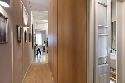 a hallway with a wooden wall and a hallway with a hallway at Bawah - 2 bedrooms in Eixample Esquerra in Barcelona