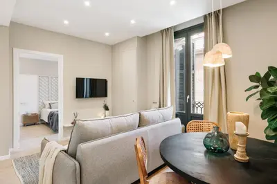 a bedroom with a bed with a book on it at Acciaroli - 2 bedrooms and terrace in Ciutat Vella in Barcelona