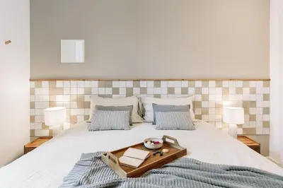 a living room with a couch and a table at Acciaroli - 2 bedrooms and terrace in Ciutat Vella in Barcelona