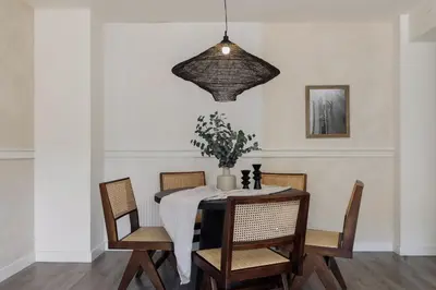 a kitchen with white cabinets and a large window at Punta - 3 bedrooms with pool in Les Corts in Barcelona