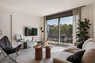a living room with a dining room table and chairs at Punta - 3 bedrooms with pool in Les Corts in Barcelona