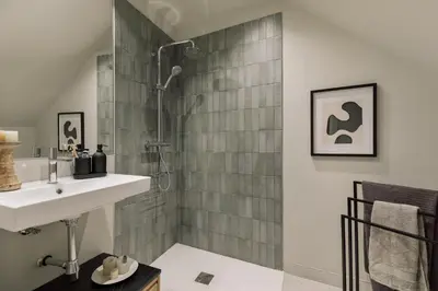 a bedroom with a bed with two lights on the wall at Asmali - 2 bedrooms and terrace in Sant Pere in Barcelona