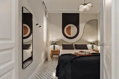 a living room with a couch and a table at Maslak - 2 bedrooms in Eixample Antiga in Barcelona