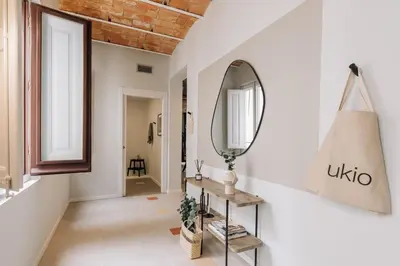 a living room with a couch and a table at Tauca - 2 bedrooms and office in Eixample Dreta in Barcelona