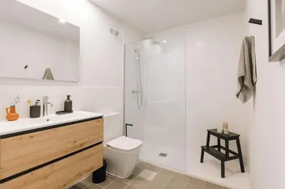 a bathroom with a shower and a toilet and a sink at Tauca - 2 bedrooms and office in Eixample Dreta in Barcelona