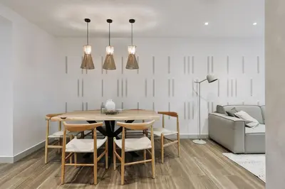 a bedroom with a bed and a large black door at Canneti - 3 bedrooms in Sagrada Família in Barcelona