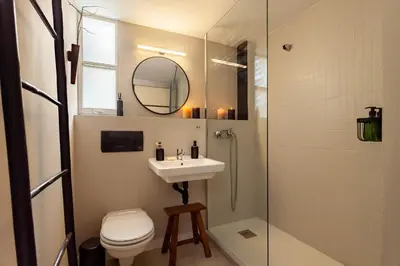 a living room with a flat screen tv on a wall at Takari - 1 bedroom and balcony in Gràcia in Barcelona
