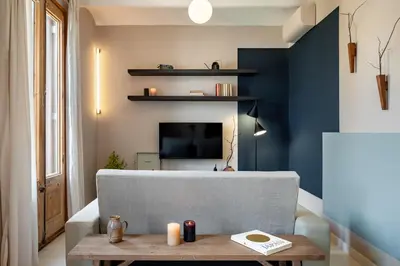 a small bedroom with a closet and a staircase at Takari - 1 bedroom and balcony in Gràcia in Barcelona