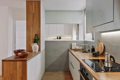 a dining room and living room with a table and chairs at Celoni - 1 bedroom and office in Sagrada Família in Barcelona
