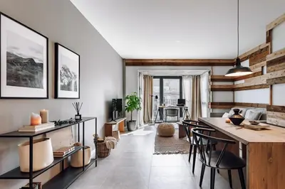 a living room with a table and some chairs at Viella - 3 bedrooms in Eixample Esquerra in Barcelona