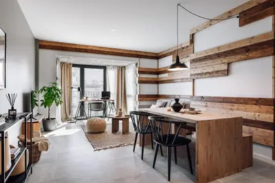 a bedroom with a bed and some plates on the wall at Viella - 3 bedrooms in Eixample Esquerra in Barcelona