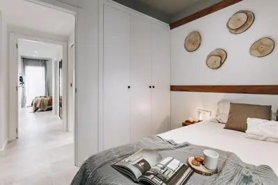 a kitchen with a wooden table and chairs in it at Viella - 3 bedrooms in Eixample Esquerra in Barcelona