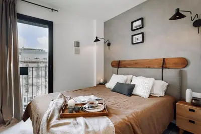 a kitchen with a table and chairs in a room at Viella - 3 bedrooms in Eixample Esquerra in Barcelona