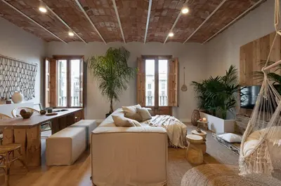 a living room with a hammock in the middle at Malay - 3 bedrooms in Eixample Dreta in Barcelona