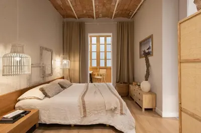 a kitchen with white cabinets and a sink at Malay - 3 bedrooms in Eixample Dreta in Barcelona